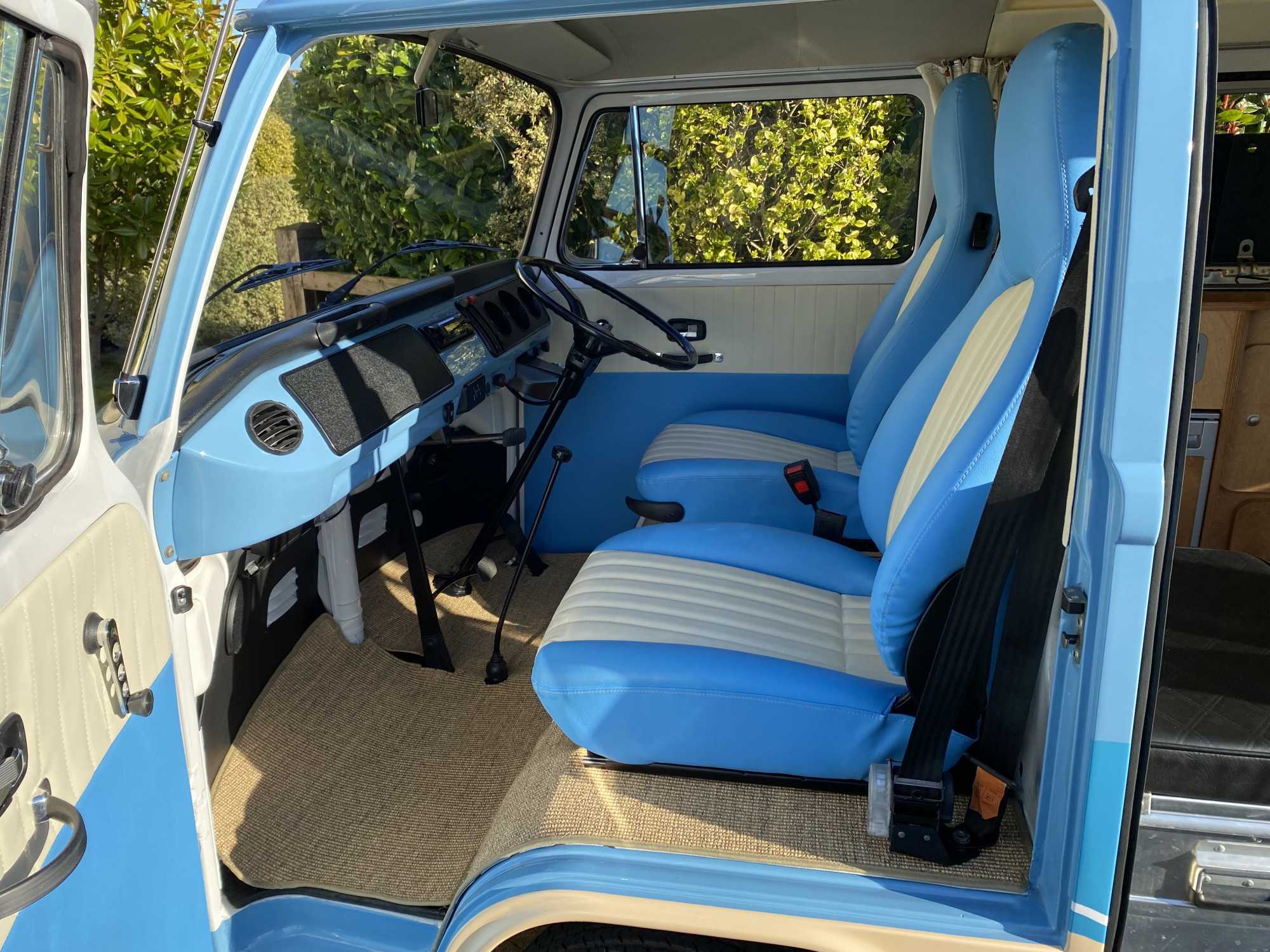 A VW T2 Classic Campervan called Campo-TV-Star and Campo's front seating area for hire in Bideford, Devon