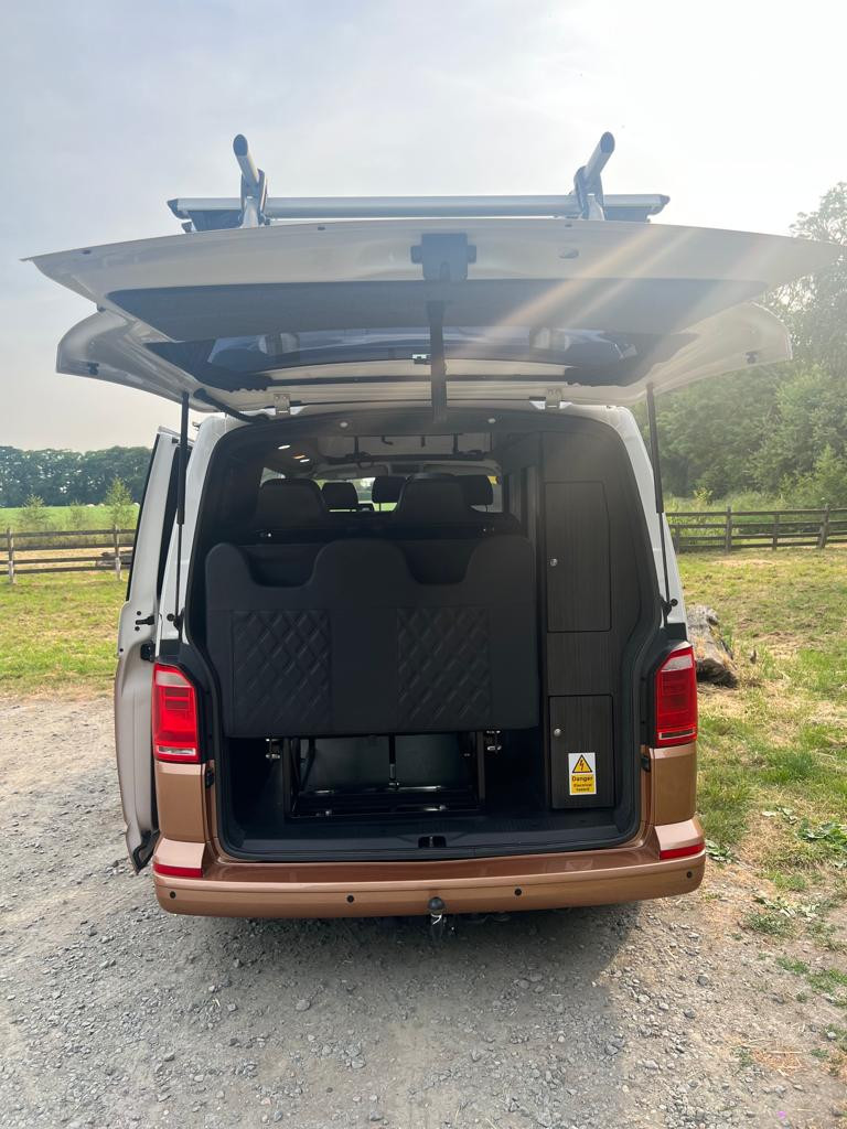 A VW T6 Campervan called T6-4Motion and Rear with Tailgate open for hire 